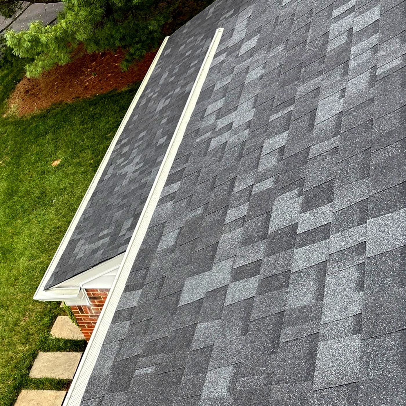 New shingles at the eave with white drip edge