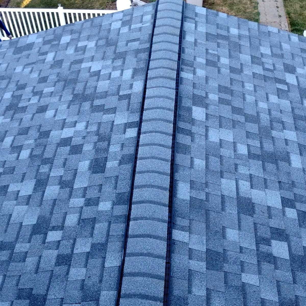 New ridge cap on blue-gray shingles