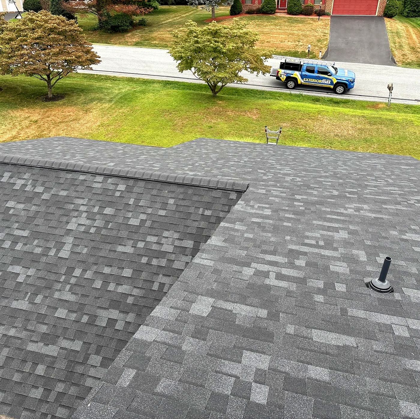 Finished roof with the ExteriorMax truck on the street below