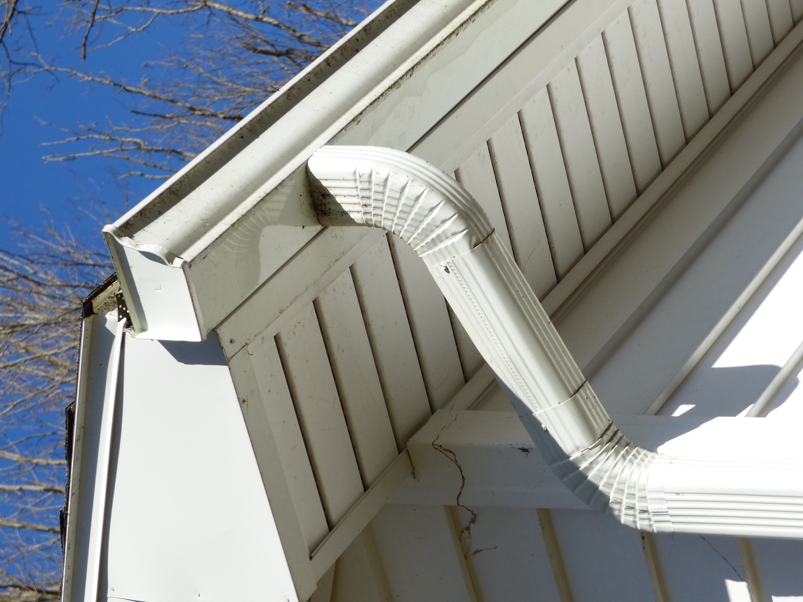 White K-style aluminum gutter at the eave corner