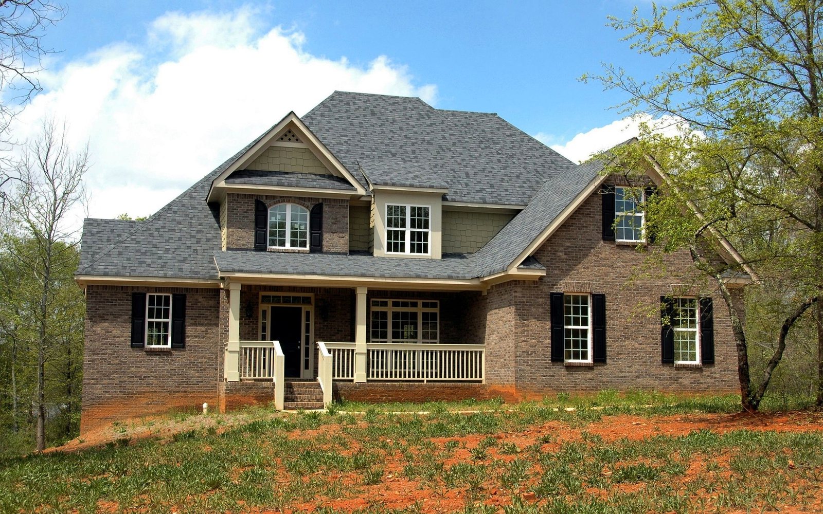 Brick home with a full architectural asphalt shingle roof