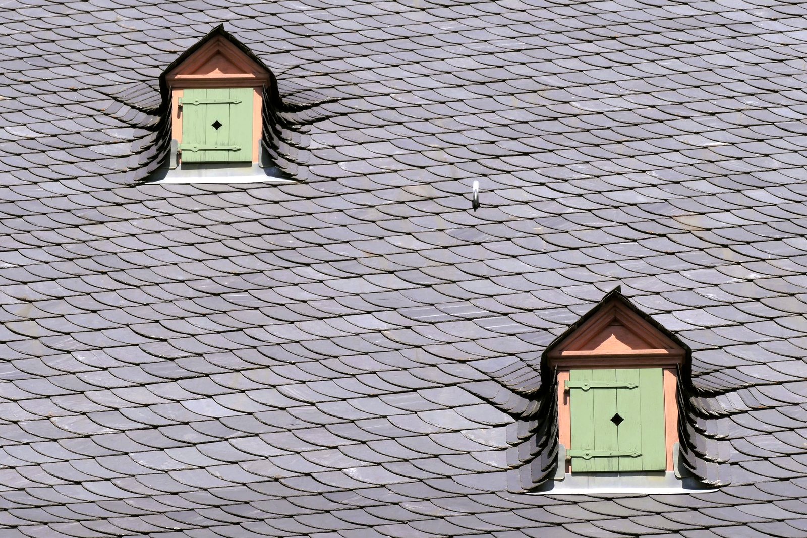 Clean, even slate roof with two small dormers