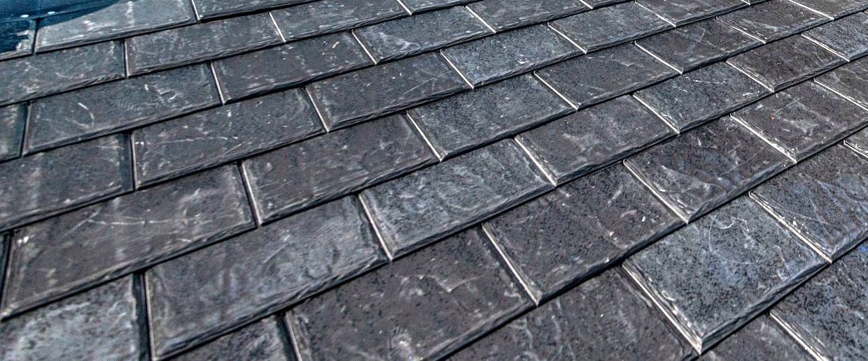 Newly installed synthetic slate roof tiles
