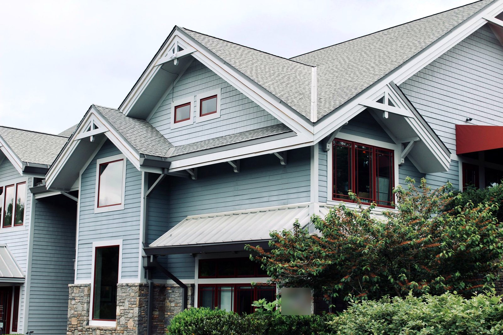 Gables with new soffit, fascia, trim brackets and blue lap siding
